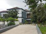 rumah-orang-tua-raynhard-sinaga-di-jl-dahlia.jpg