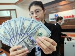 rupiah-kembali-melemah_20150729_050734.jpg