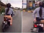 sambil-mengendarai-sepeda-motor-wanita-tersebut-membuka-rok-berwarna-hitam-yang-ia-kenakan.jpg