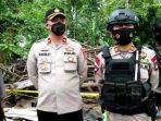 satbrimob-polda-banten-saat-sisir-lokasi-ledakan-di-desa-tangkil-sari-banten.jpg