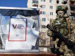 seorang-prajurit-rusia-berdiri-di-dekat-kotak-suara-di-kota-sievierodonetsk-ukraina.jpg