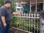 seorang-warga-menunjukkan-pagar-bermaterial-besi-lokasi-ditemukannya.jpg