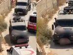 seorang-warga-palestina-yang-terluka-diikat-di-atas-kap-mobil-militer-israel.jpg