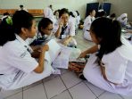 siswa-smpn-1-jakarta-ikuti-unbk_20190422_121129.jpg
