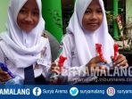 siswi-smpn-19-kota-malang-menunjukkan-semprotan-air-d_20170808_161049.jpg