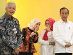siti-atikoh-bisik-bisik-dengan-iriana-jokowi.jpg