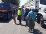 situasi-di-lokasi-kecelakaan-antara-truk-trailer-dan-motor-rx-king_20180816_182759.jpg