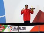 syuci-indriani-sumbang-emas-cabang-para-renang_20181008_230551.jpg
