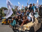 taliban-pamerkan-alutsista-peninggalan-as_20240816_080943.jpg