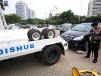 target-pendapatan-retribusi-parkir-liar-dki_20160316_190743.jpg