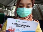 tenaga-kesehatan-jalani-vaksinasi-covid-19-di-rsu-bungsu_20210118_185115.jpg