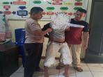 tersangka-as-alias-an-20-warga-lingkungan-nelayan-ii-gg-makam-sungailiat.jpg