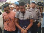 tersangka-rh-digiring-polisi-saat-tiba-di-polres-sukabumi-kota.jpg