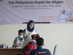 test-antigen-bagi-penumpang-bus-akap-di-terminal-pulo-gebang_20211221_165522.jpg