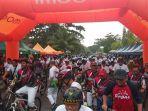 tiga-ribu-pesepeda-peserta-gowes-di-kota-tarakan-tetap-semangat-meski-diiringi-hujan.jpg