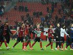 tim-leverkusen-merayakan-setelah-pertandingan-sepak-bola-grup-g.jpg