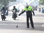 tim-saber-ranjau-paku-amankan-jalur-arus-balik-lebaran_20180620_173000.jpg
