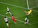 timnas-iran-berhasil-menjebol-gawang-jordan-pickford_20221121_221658.jpg