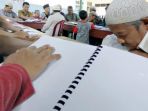 tuna-netra-membaca-alquran_20170602_135119.jpg