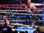 tyson-fury-kiri-dari-inggris-terjatuh-saat-ia-bertarung-melawan-ngannou.jpg