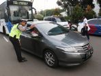 uji-coba-ganjil-genap-di-tol-tangerang-2_20180417_155434.jpg