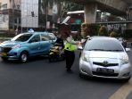 uji-coba-tilang-uji-emisi-di-jakarta_20230825_172028.jpg