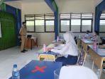 uptdsmp-negeri-18-depok-melakukan-simulasi-sebelum-ptmt-selasa-280921.jpg