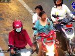 video-viral-wanita-makan-saat-naik-motor-diingatkan-petugas-loh-mbak-malah-terobos-lampu-merah.jpg