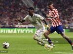 vinicius-junior-kiri-bersaing-dengan-gelandang-atletico-madrid-pablo-barrios.jpg