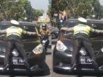 viral-polisi-hentikan-mobil-dengan-menempel-di-jendela.jpg