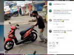 viral-pria-parkir-motor-hanya-dengan-satu-tangan-ini-sosok-dan-cerita-lengkapnya.jpg