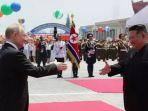 vladimir-putin-disambut-kim-jong-un-di-pyongyang-19-juni-2024.jpg