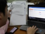 wajib-pajak-laporkan-spt-tahunan_20160328_192916.jpg