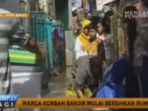 warga-korban-banjir-mulai-bersihkan-rumah_20161118_140338.jpg