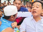 warga-rusun-muara-baru-mencoba-memeluk-gibran-lalu-diamankan-ajudan-saat-kunjunga.jpg