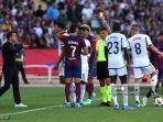 xavi-saat-barcelona-bertarung-melawan-madrid.jpg