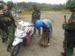yonif-400raider-berhasil-amankan-1-kg-ganja-di-papua_20150914_132306.jpg