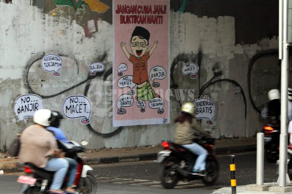 Mural Tagih Janji Cagub Cawagub DKI
