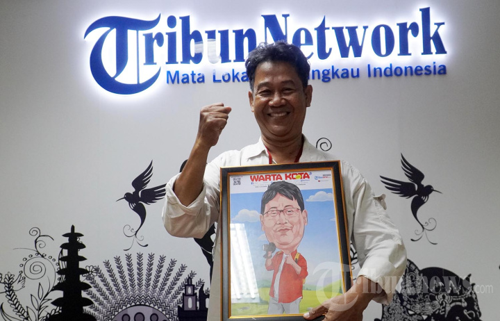 Fotografer WartaKota M Nur Iksan Arief Purnakarya