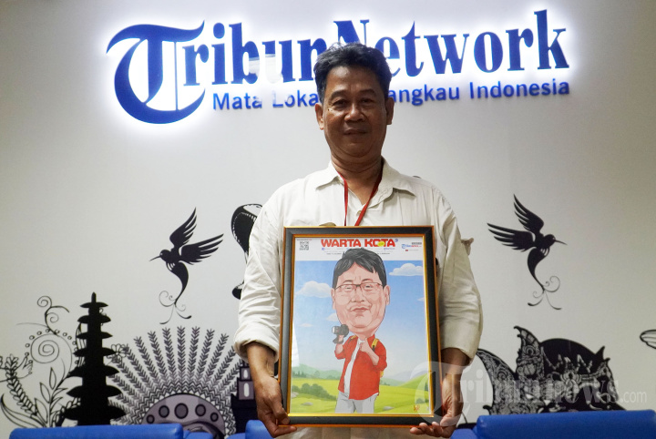 Fotografer WartaKota M Nur Iksan Arief Purnakarya