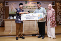AXA Mandiri Salurkan Surplus Underwriting 2023