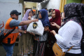 Penyaluran-Serentak-Zakat-Fitrah-di-29-Kota_20250330_000130.jpg