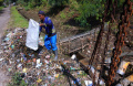 Sampah-Menyumbat-Pompa-Pengendali-Banjir-di-Polder-Cipalasari-1_20240913_213556.jpg