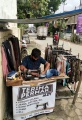 Andri Terima Jasa Permak dan Jualan Pakaian di Trotoar