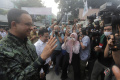 anies-disambut-cak-imin-saat-hadiri-rapat-pemenangan_20230911_160907.jpg