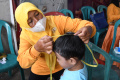 antisipasi-campak-dinkes-malang-melakukan-imunisasi-balita_20230202_133942.jpg