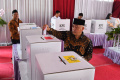 bupati-malang-gunakan-hak-pilih-di-pemilu-2024_20240214_151414.jpg
