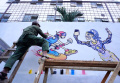 Dosen dan Mahasiswa DKV Unpas Buat Mural di Kampung Wisata