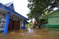 Evakuasi Korban Banjir di Bantaran Sungai…