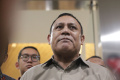 firli-bahuri-usai-menjalani-pemeriksaan-di-bareskrim-polri_20231201_212020.jpg